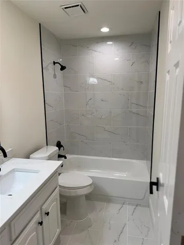 a view of wooden floor and windows in a room