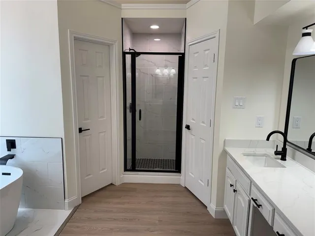 a bathroom with a double vanity sink and mirror