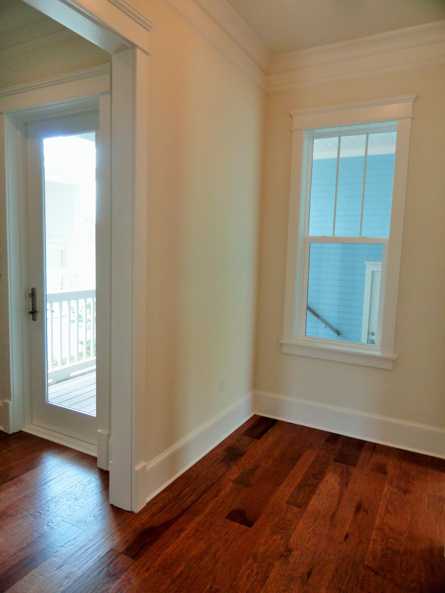 89 Clipper Street Inlet Beach, FL 32461 - Photo 16 of 50 an empty room with wooden floor and windows