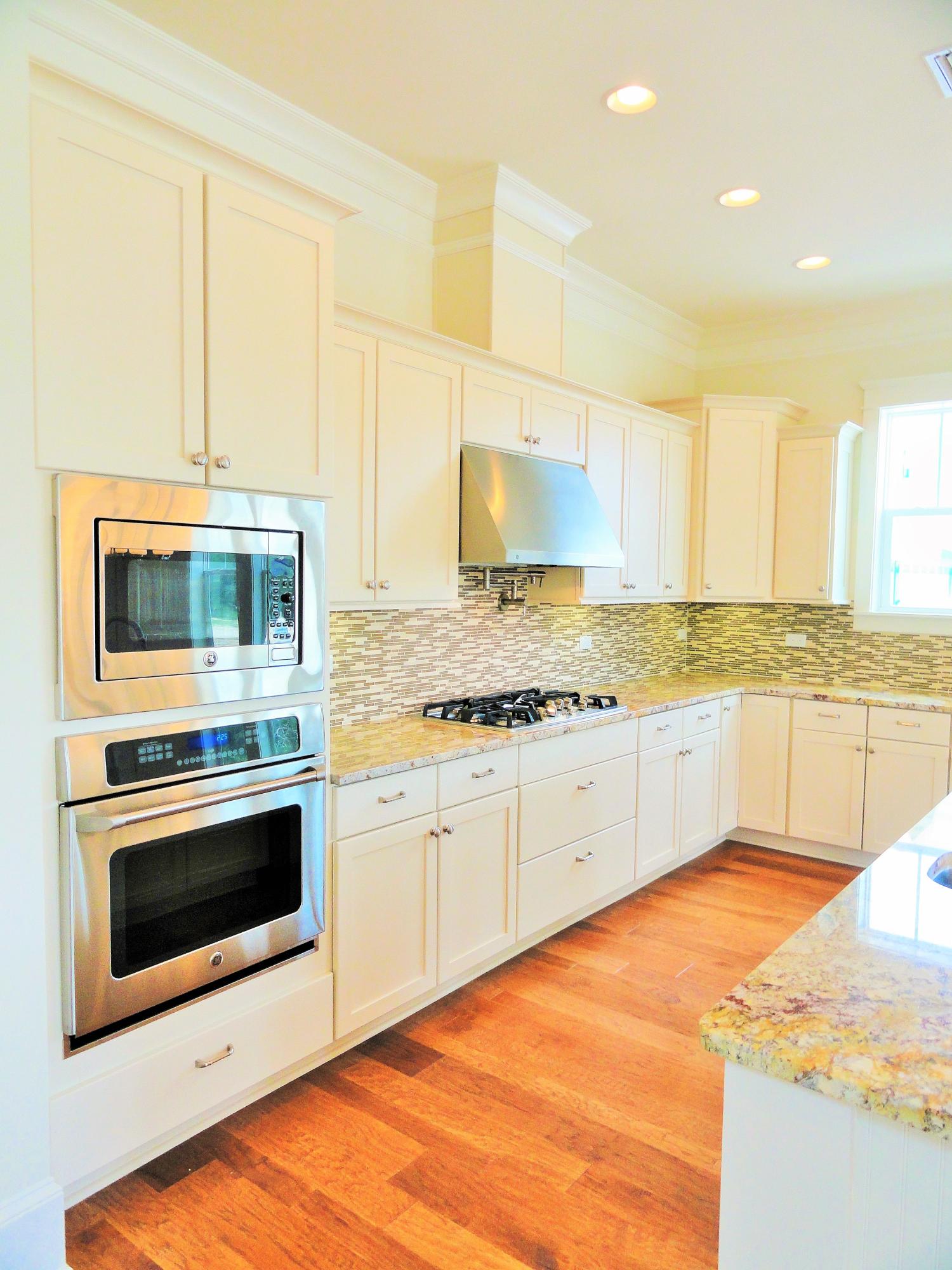 89 Clipper Street Inlet Beach, FL 32461 - Photo 28 of 50 a kitchen with stainless steel appliances granite countertop a stove and a sink