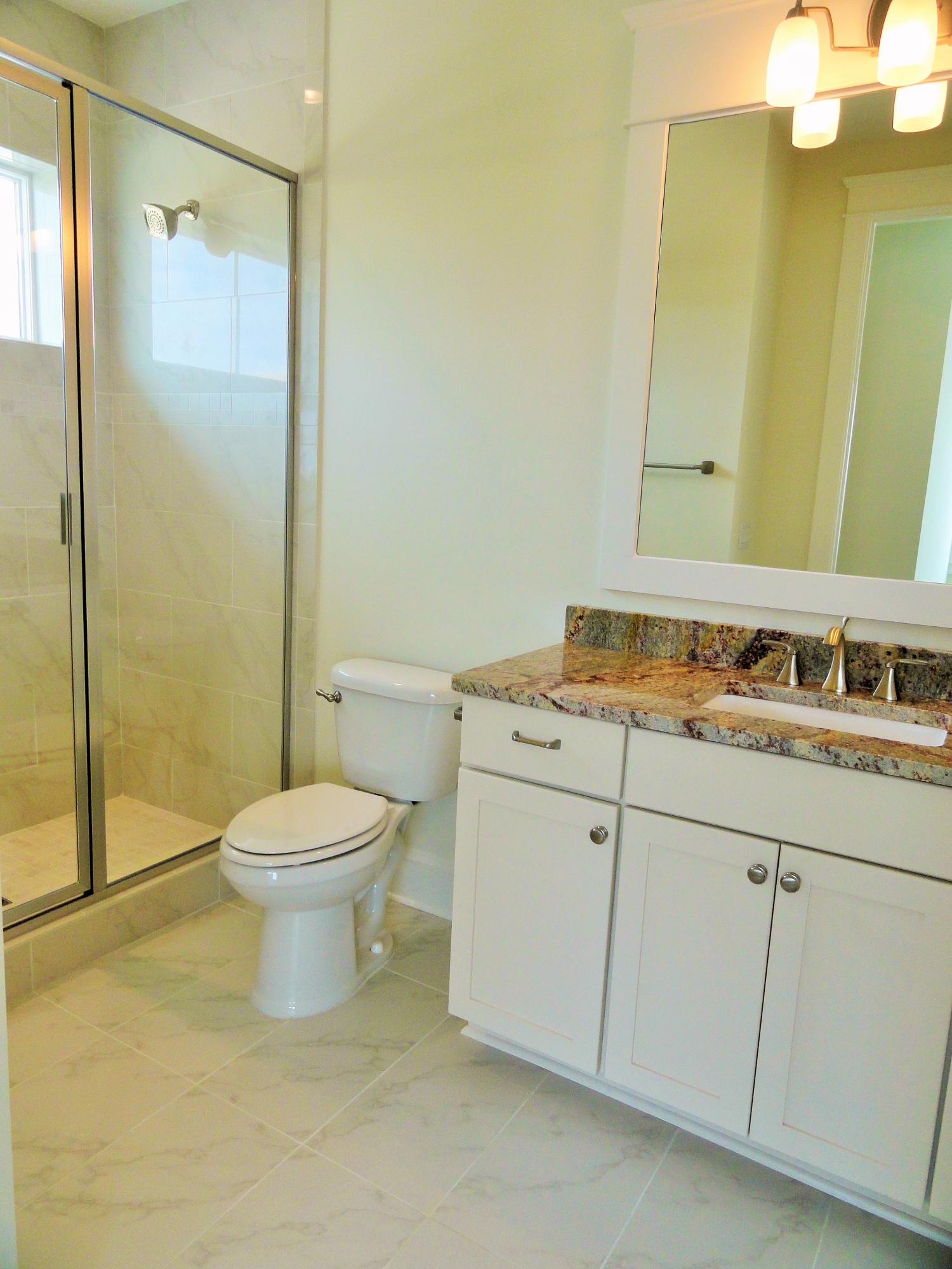89 Clipper Street Inlet Beach, FL 32461 - Photo 37 of 50 a bathroom with a granite countertop sink toilet and shower