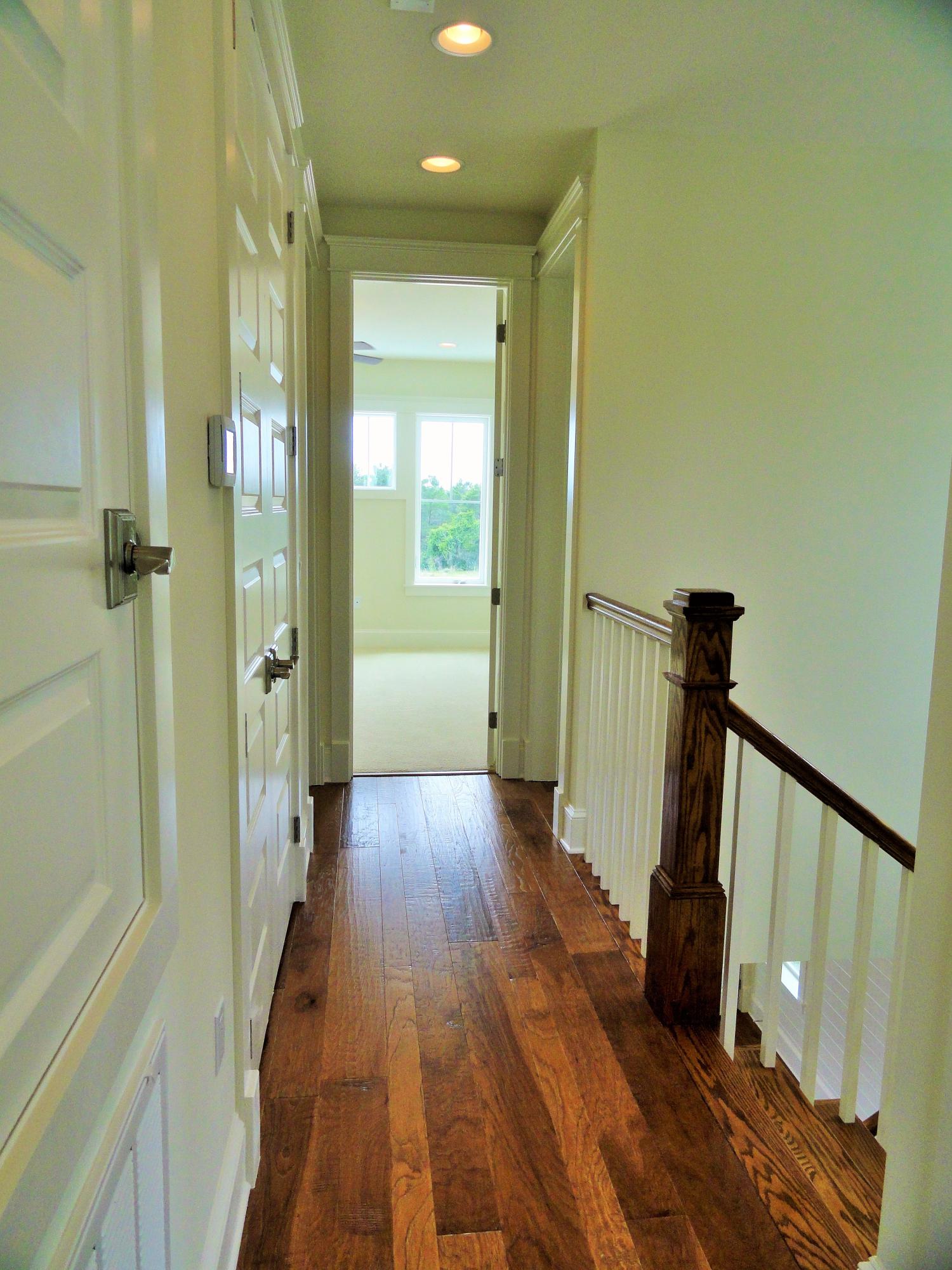 89 Clipper Street Inlet Beach, FL 32461 - Photo 39 of 50 a view of a hallway with wooden floor and staircase