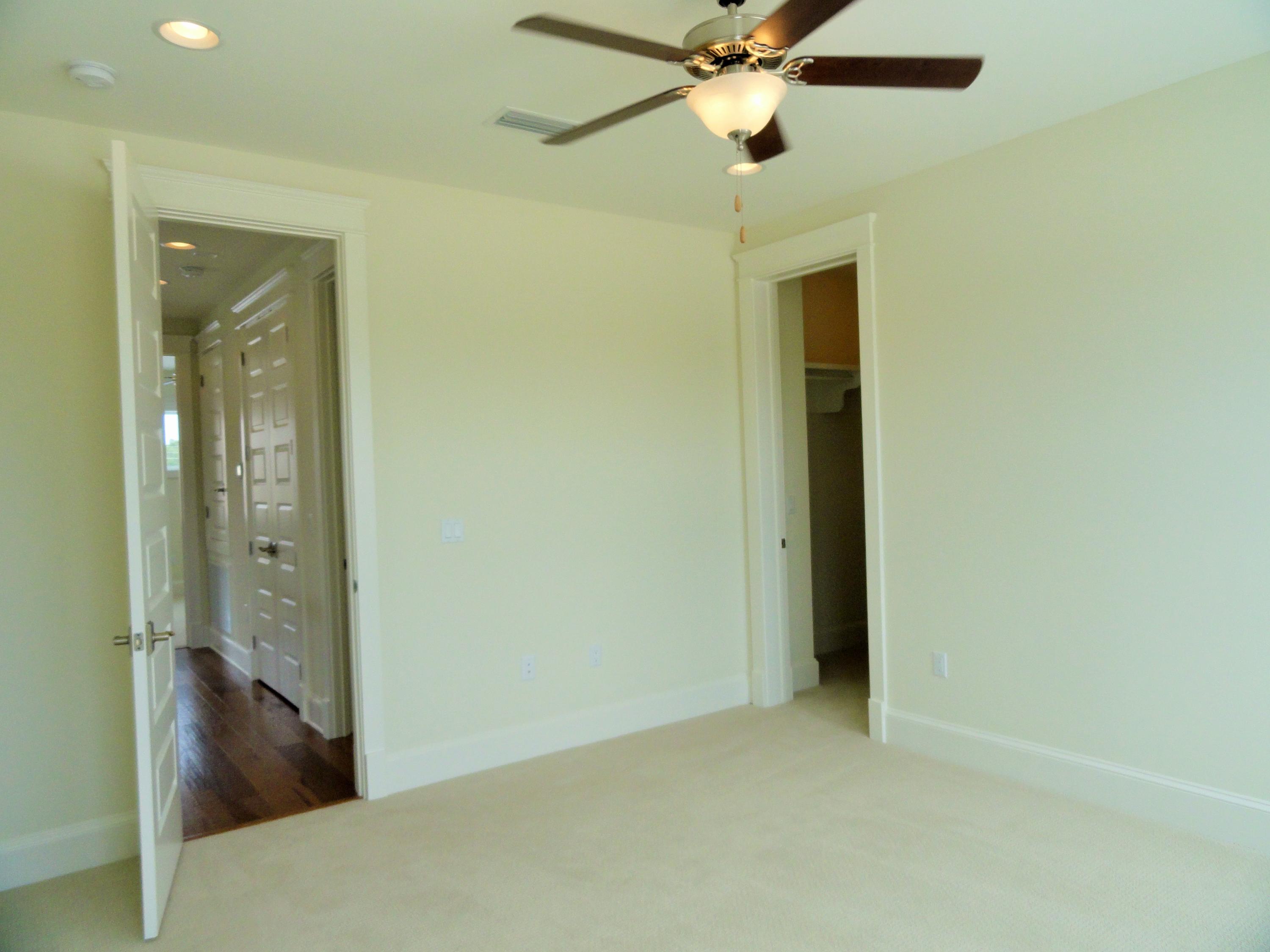 89 Clipper Street Inlet Beach, FL 32461 - Photo 42 of 50 an empty room and chandelier fan