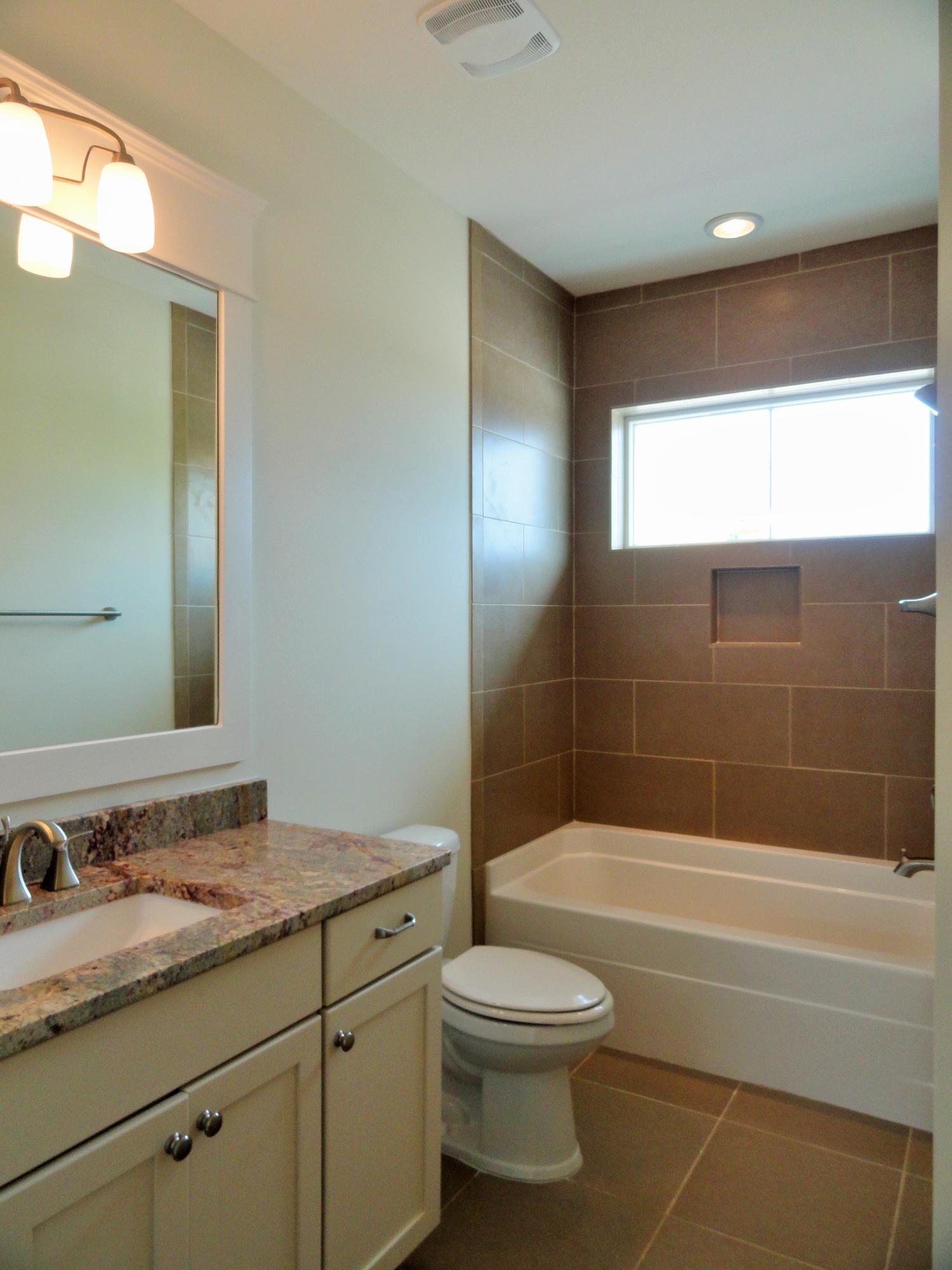 89 Clipper Street Inlet Beach, FL 32461 - Photo 44 of 50 a bathroom with a granite countertop sink a toilet and shower