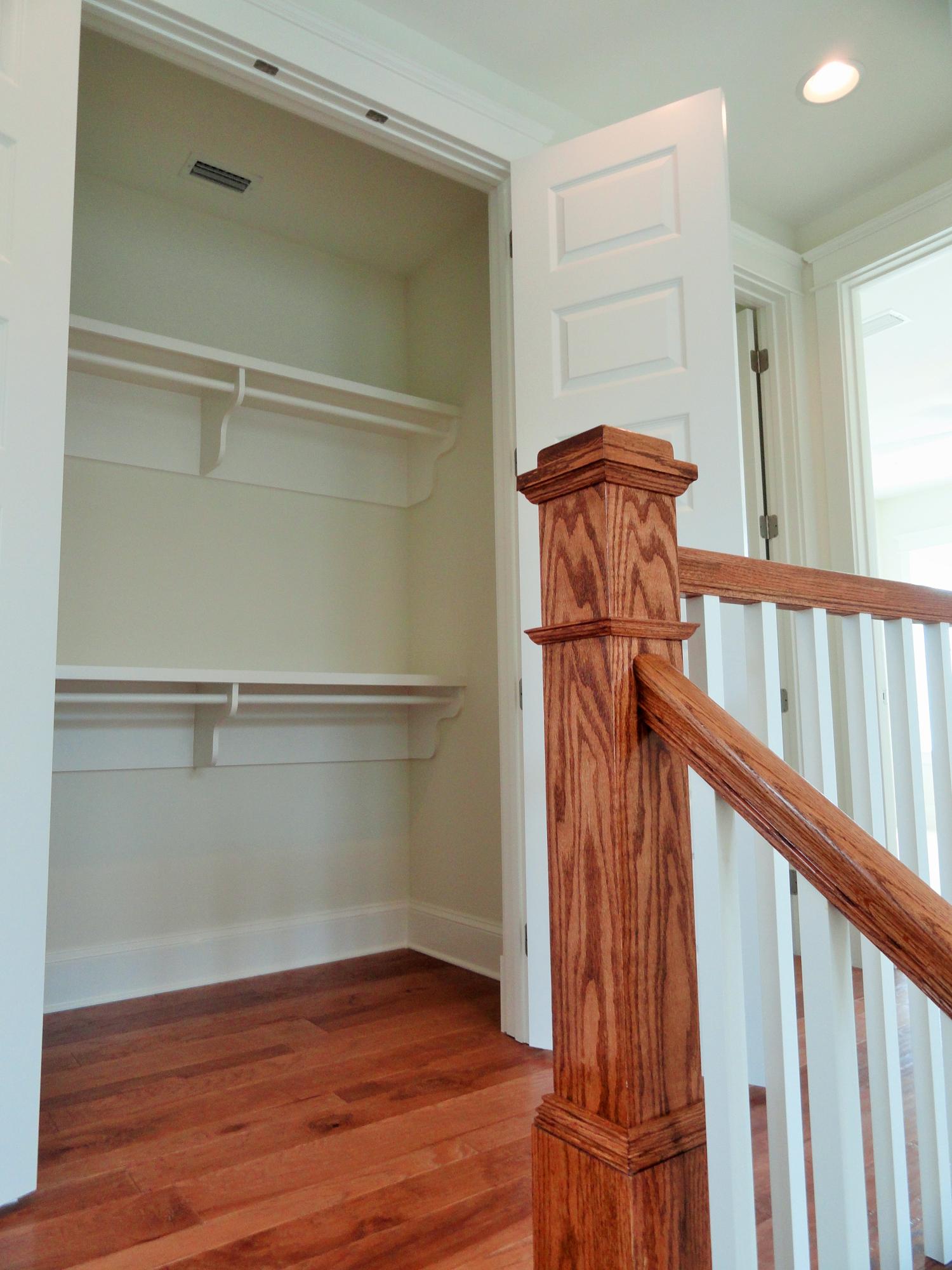 89 Clipper Street Inlet Beach, FL 32461 - Photo 46 of 50 a view of a hallway with wooden floor and staircase