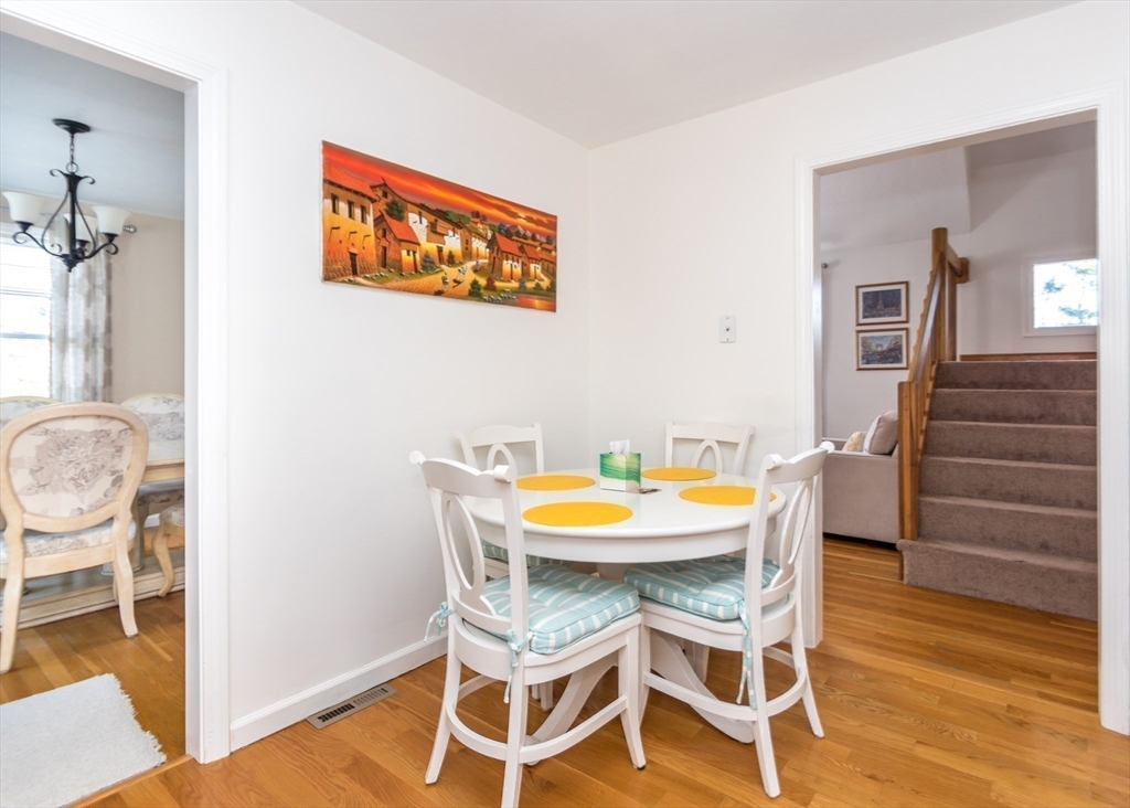 46 Timberline Road Millis, MA 02054 - Photo 11 of 38 a view of a dining room with furniture and wooden floor