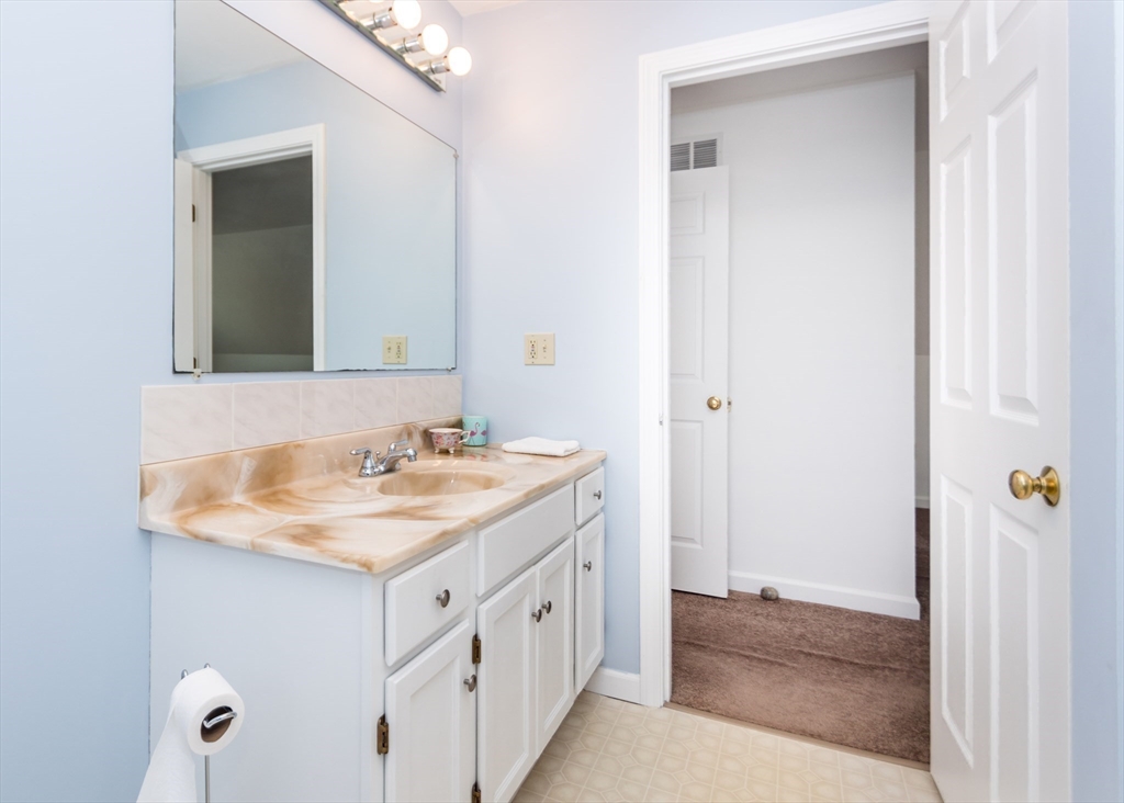 46 Timberline Road Millis, MA 02054 - Photo 14 of 38 a bathroom with a sink and a mirror