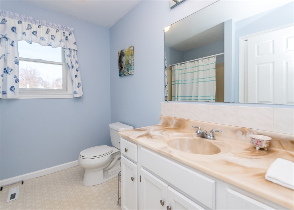 46 Timberline Road Millis, MA 02054 - Photo 15 of 38 a bathroom with a granite countertop toilet sink and mirror