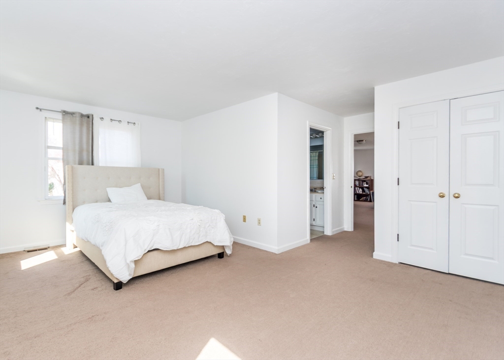 46 Timberline Road Millis, MA 02054 - Photo 16 of 38 a spacious bedroom with a bed and closet