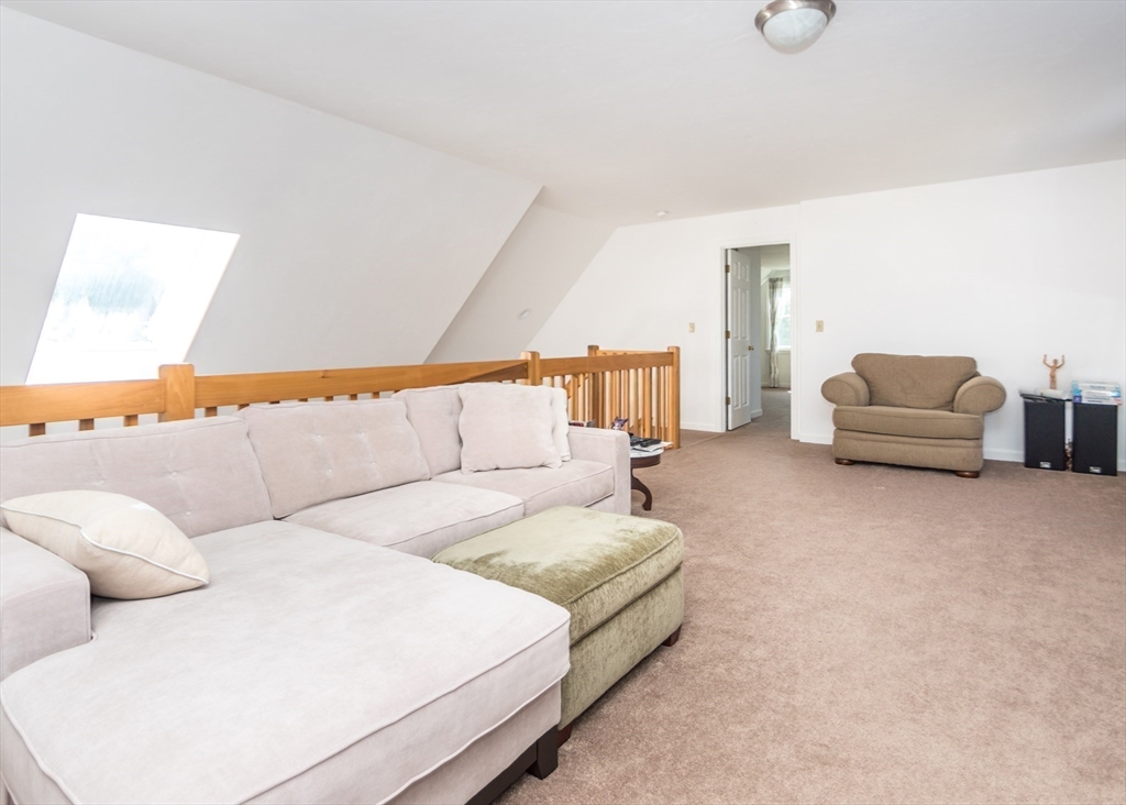 46 Timberline Road Millis, MA 02054 - Photo 18 of 38 a living room with furniture and a couch
