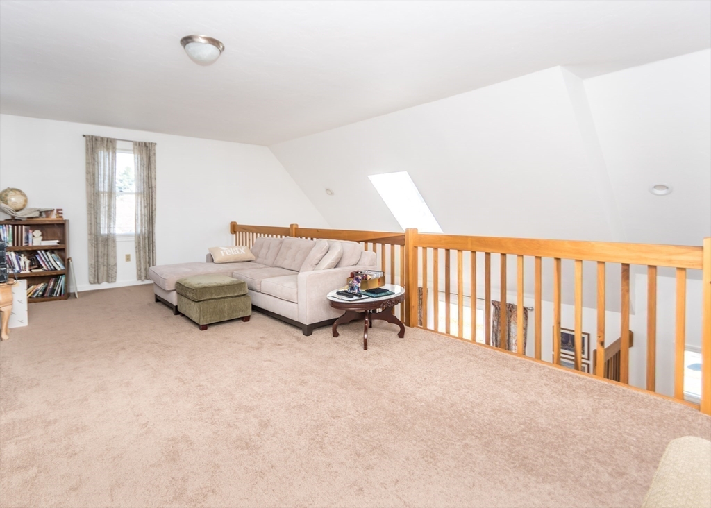 46 Timberline Road Millis, MA 02054 - Photo 19 of 38 a living room with furniture and a rug