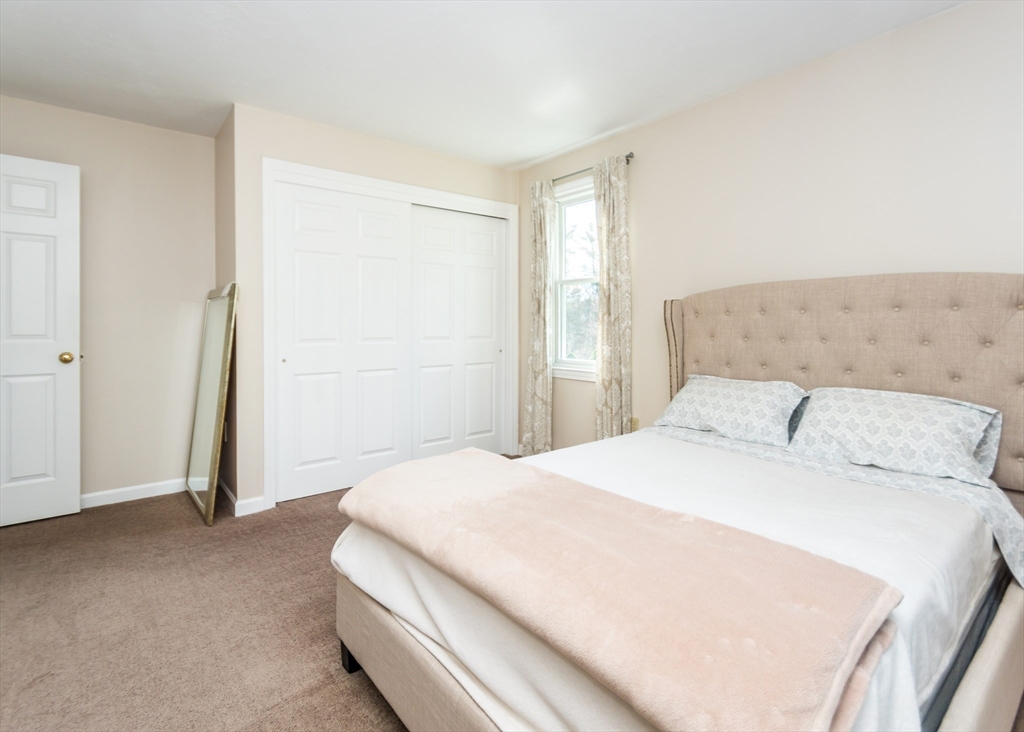 46 Timberline Road Millis, MA 02054 - Photo 25 of 38 a spacious bedroom with a bed and a window