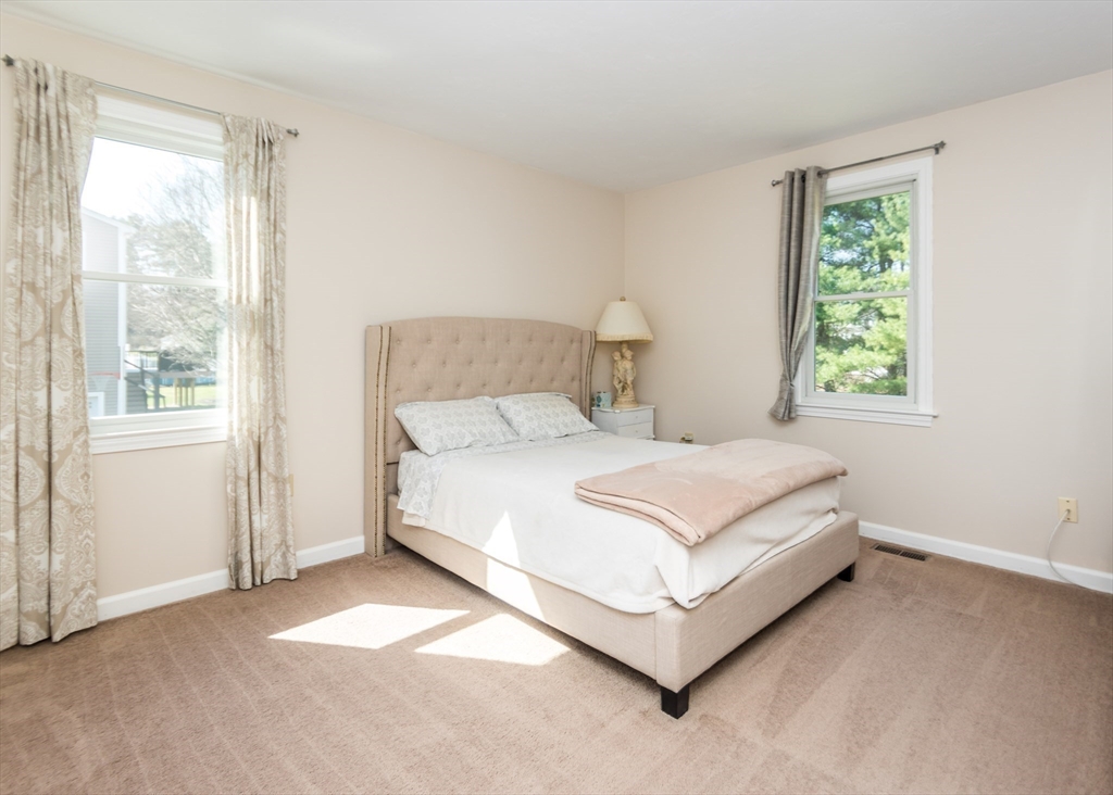 46 Timberline Road Millis, MA 02054 - Photo 26 of 38 a white bed sitting in a bedroom next to a window