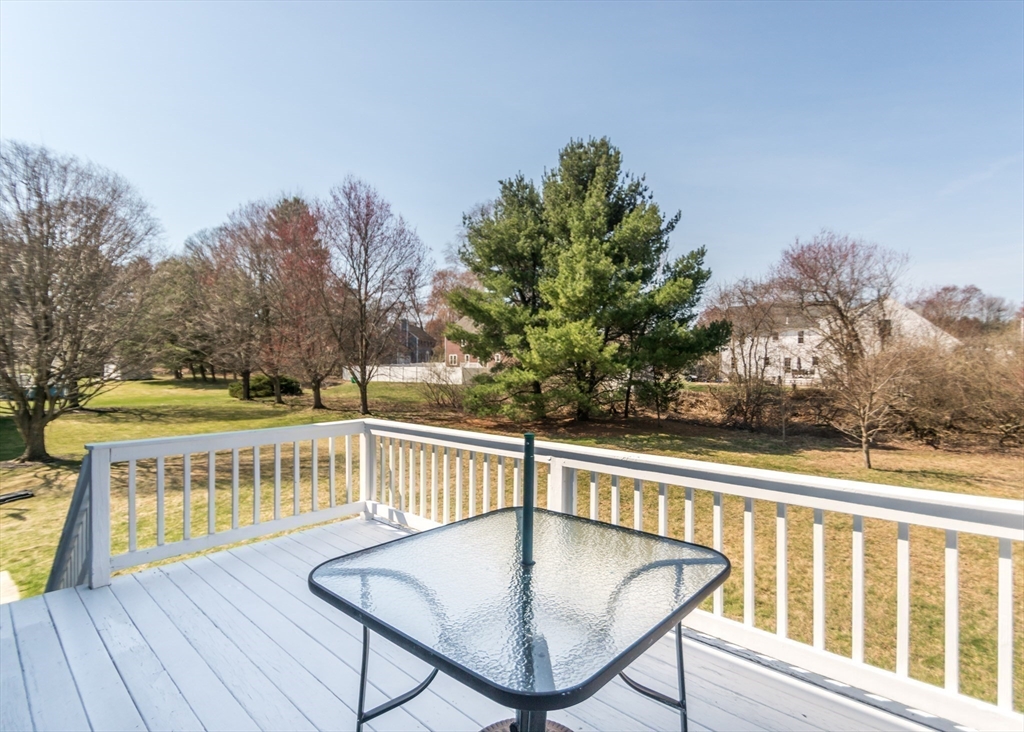 46 Timberline Road Millis, MA 02054 - Photo 34 of 38 a view of a balcony with wooden floor and fence