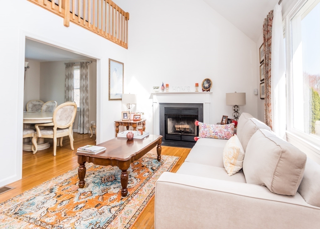 46 Timberline Road Millis, MA 02054 - Photo 5 of 38 a living room with furniture a fireplace and a window
