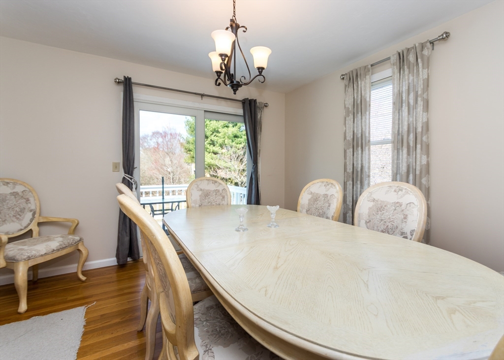 46 Timberline Road Millis, MA 02054 - Photo 8 of 38 a living room with furniture and a chandelier