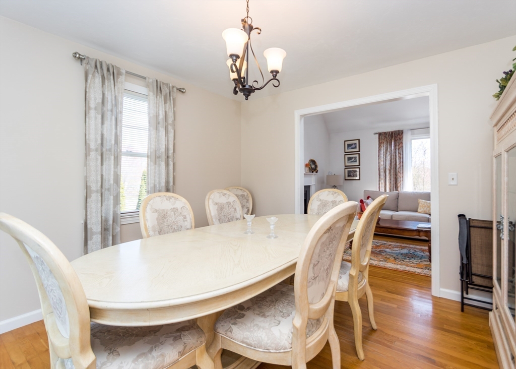 46 Timberline Road Millis, MA 02054 - Photo 9 of 38 a view of a dining room with furniture wooden floor and chandelier
