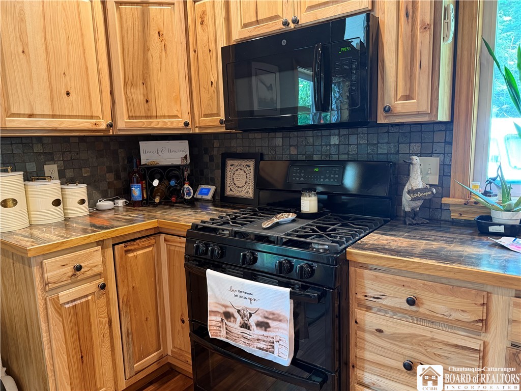 9039 Kidder Road Mina, NY 14781 - Photo 26 of 48 Hickory Kitchen cabinets, gas double oven stove