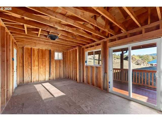 a view of kitchen with cabinets and wooden floor