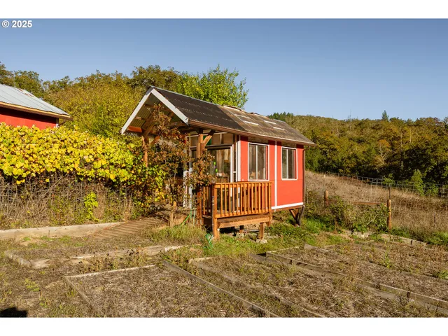 a view of a field with ocean view