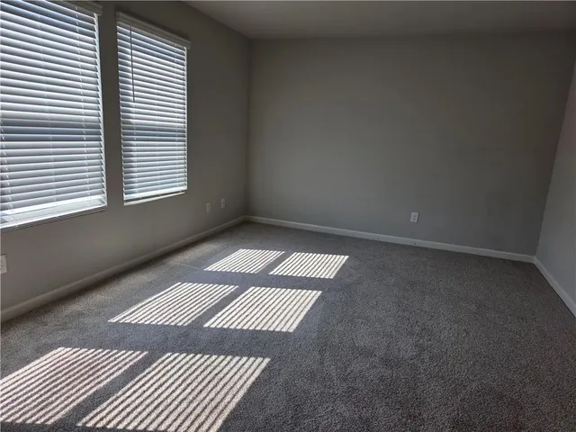 an empty room with a rug