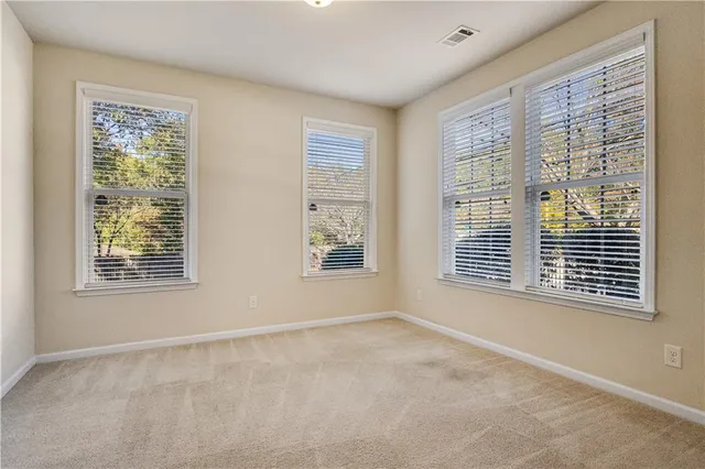 a bathroom with a toilet sink and a mirror