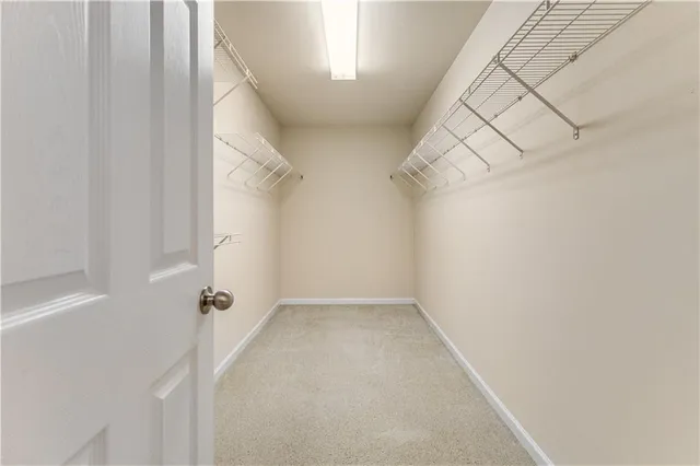 a view of room with window and ceiling fan