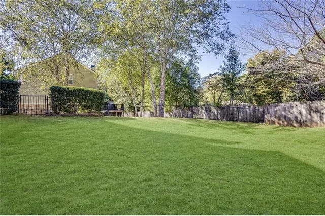 an aerial view of a house with a swimming pool