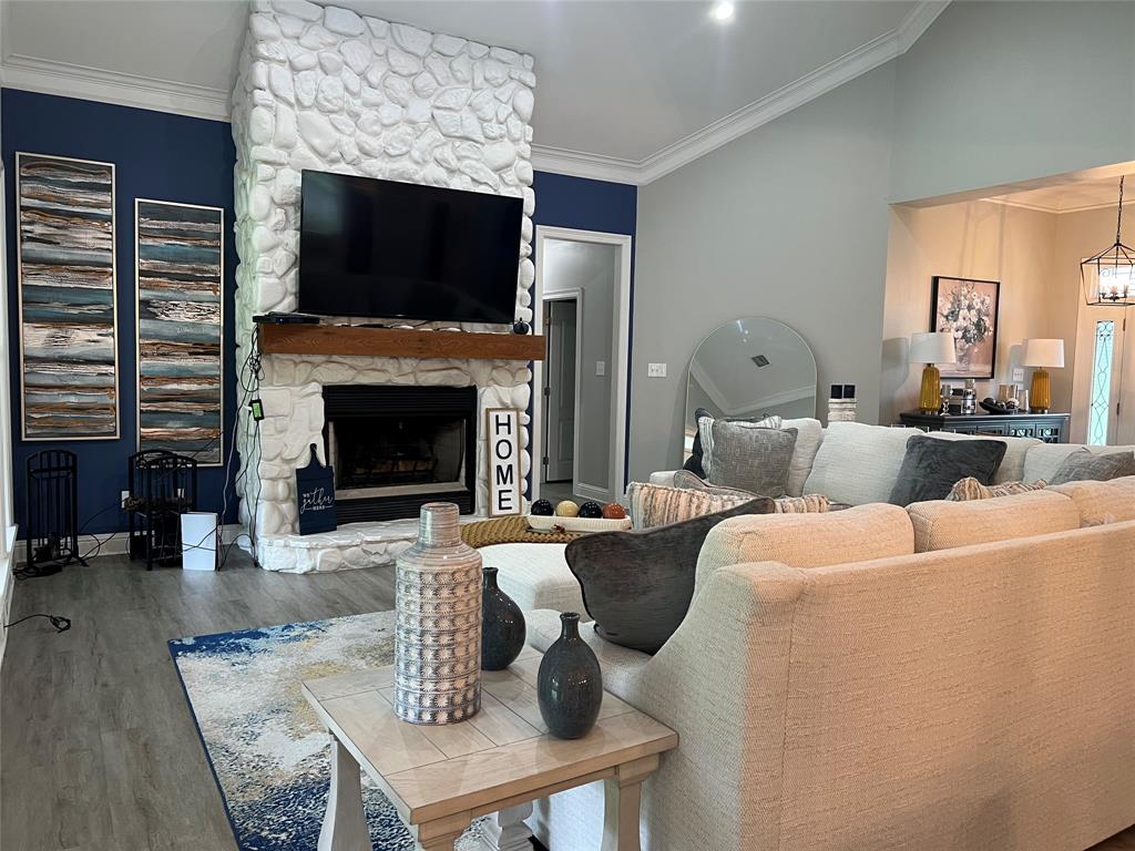 5270 Quad J Road Shreveport, LA 71107 - Photo 5 of 18 a living room with furniture a fireplace and a flat screen tv