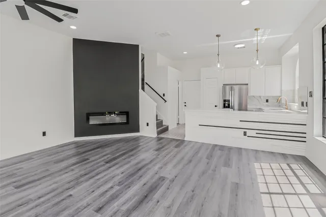 a bathroom with a sink a mirror and shower