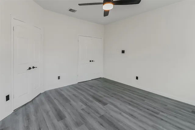 a view of room with wooden floor