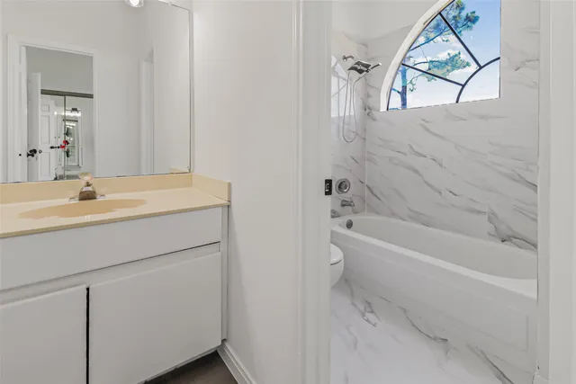 a bathroom with a sink and a bathtub