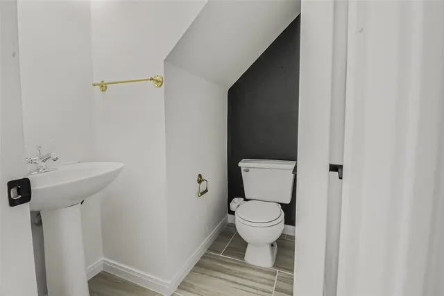 a bathroom with a toilet and a sink