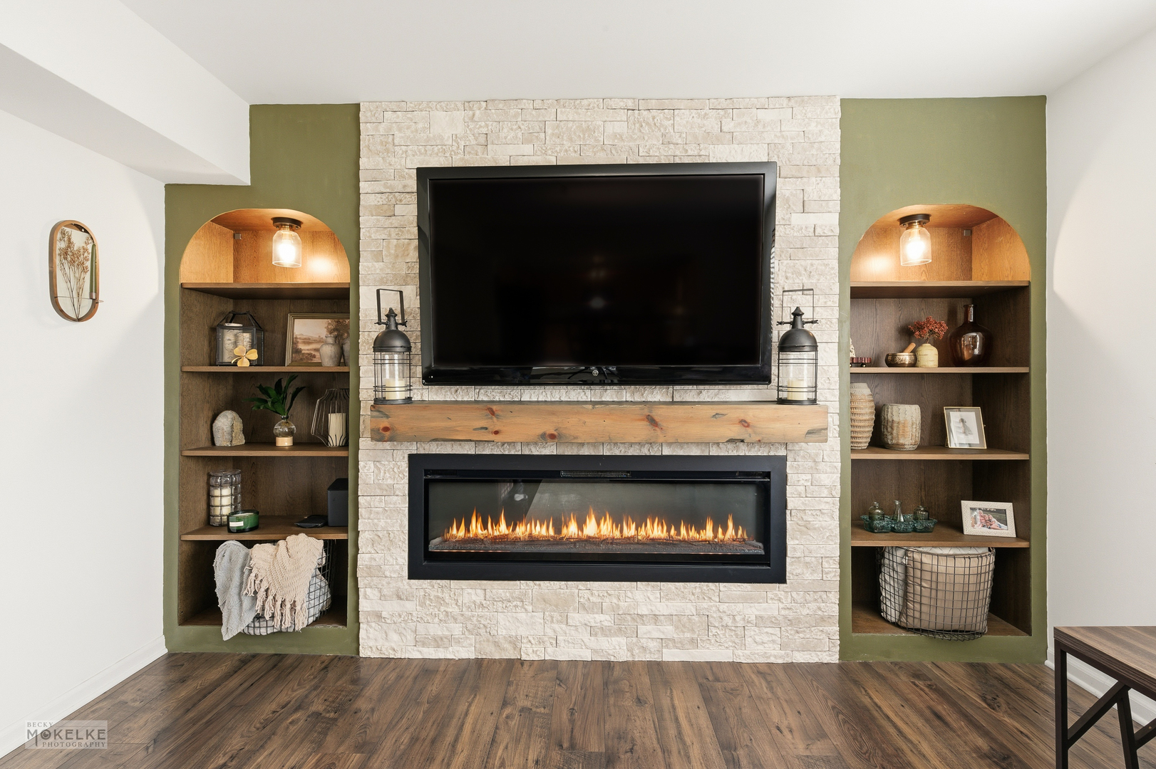 814 Edgewater Drive Minooka, IL 60447 - Photo 16 of 46 a living room with a fireplace a flat screen tv and a fireplace