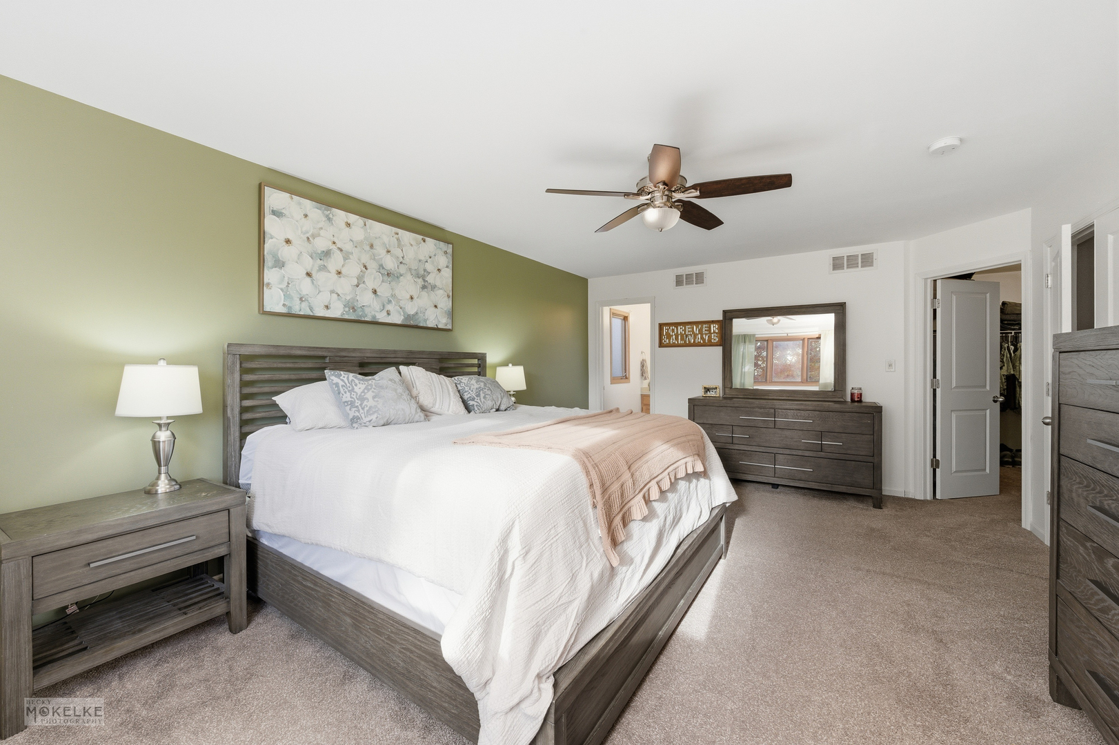 814 Edgewater Drive Minooka, IL 60447 - Photo 21 of 46 a spacious bedroom with a bed and a chandelier