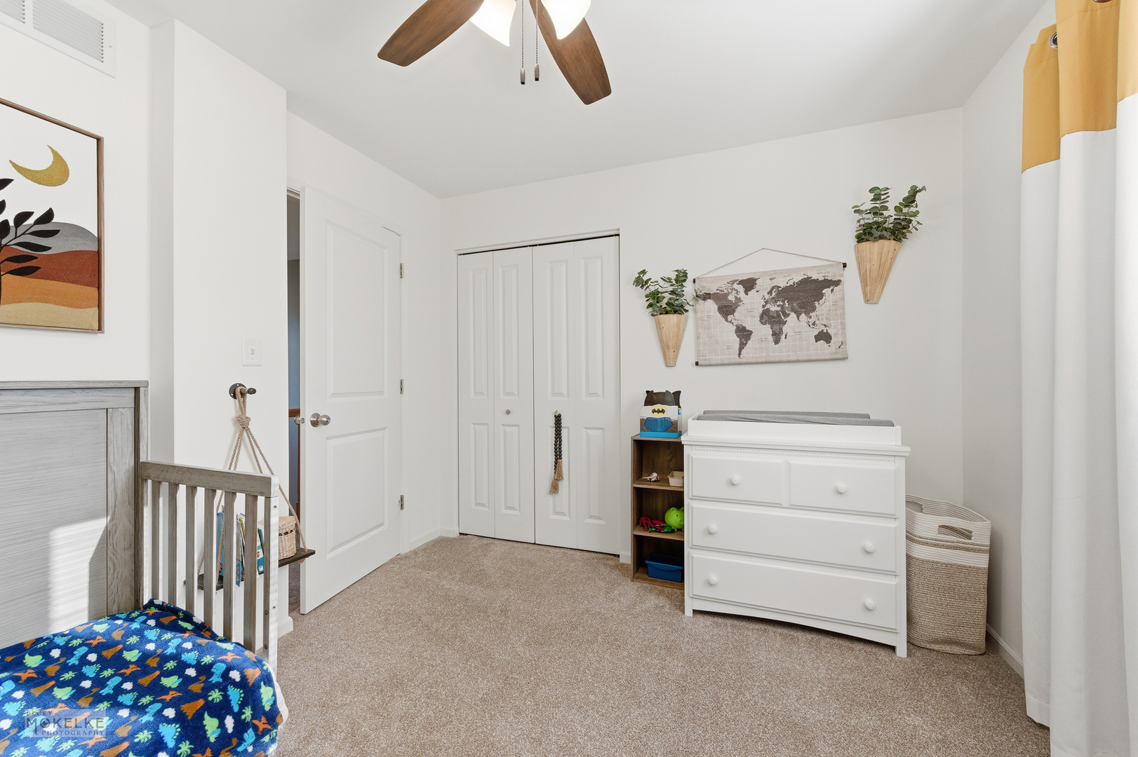 814 Edgewater Drive Minooka, IL 60447 - Photo 26 of 46 a view of a bedroom with baby crib and dresser