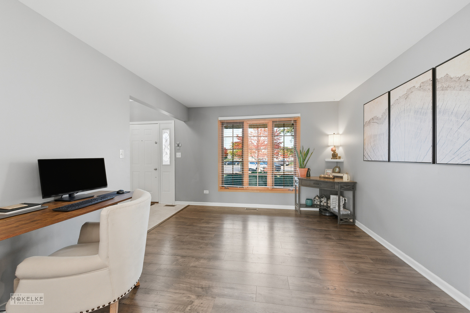 814 Edgewater Drive Minooka, IL 60447 - Photo 9 of 46 a view of livingroom with furniture flat screen tv and wooden floor