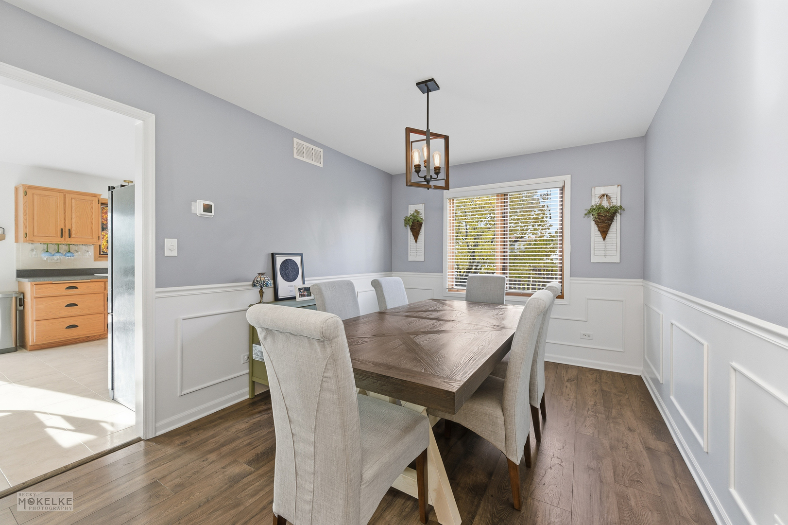 814 Edgewater Drive Minooka, IL 60447 - Photo 10 of 46 a view of a dining room with furniture window and wooden floor