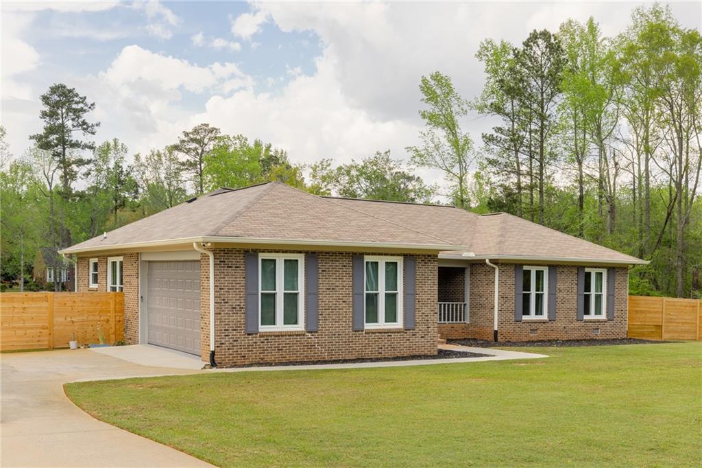 434 Rawley Road Americus, GA 31719 - Photo 6 of 50 a front view of a house with a garden