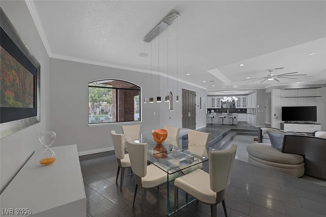 9 Quail Run Road Henderson, NV 89014 - Photo 10 of 57 An inviting dining area flows into an open living space, featuring high ceilings and modern fixtures.