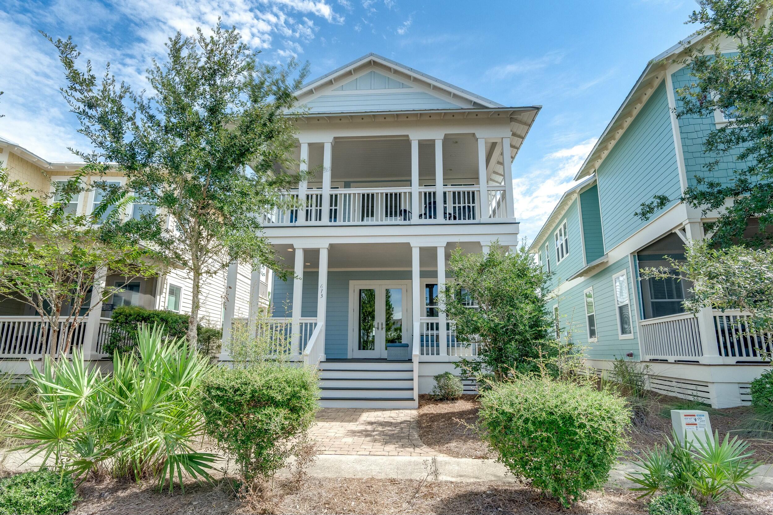 a view of house with garden and entryway