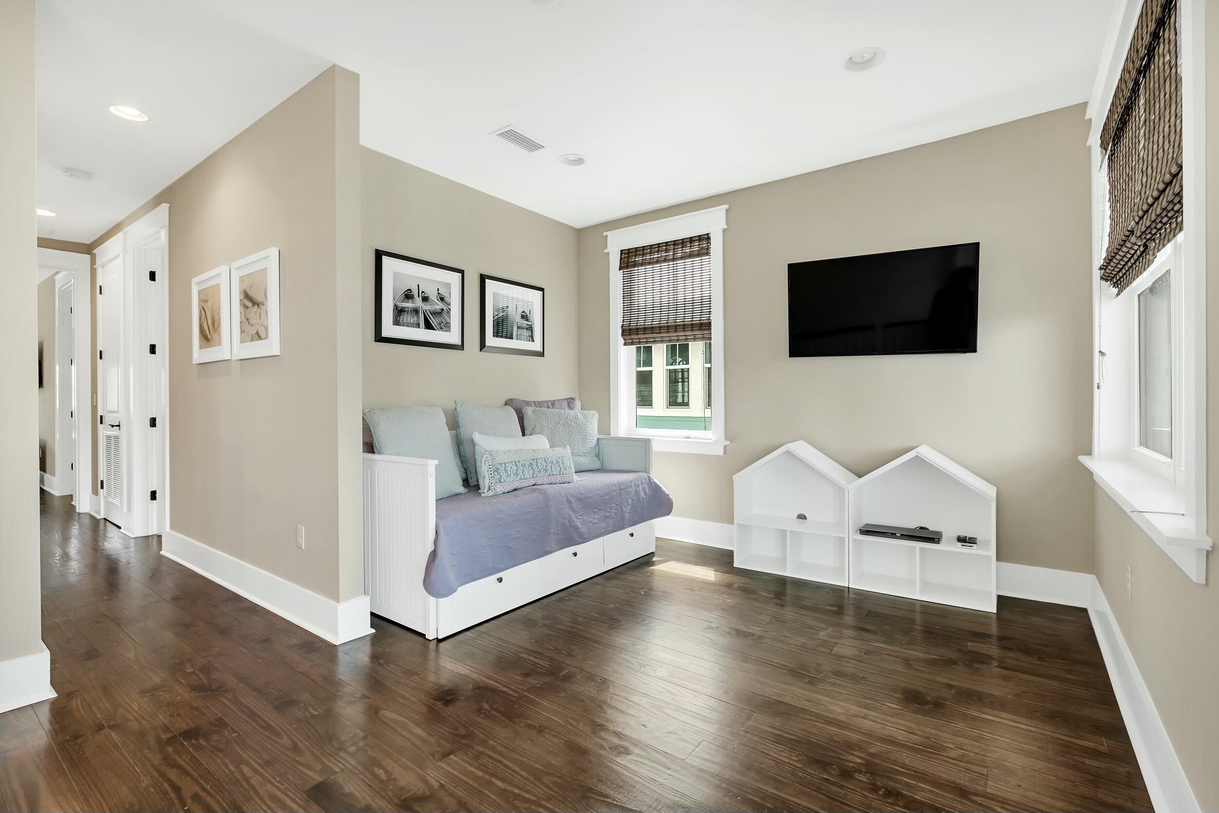 673 Flatwoods Forest Loop Santa Rosa Beach, FL 32459 - Photo 14 of 41 a living room with furniture and a flat screen tv