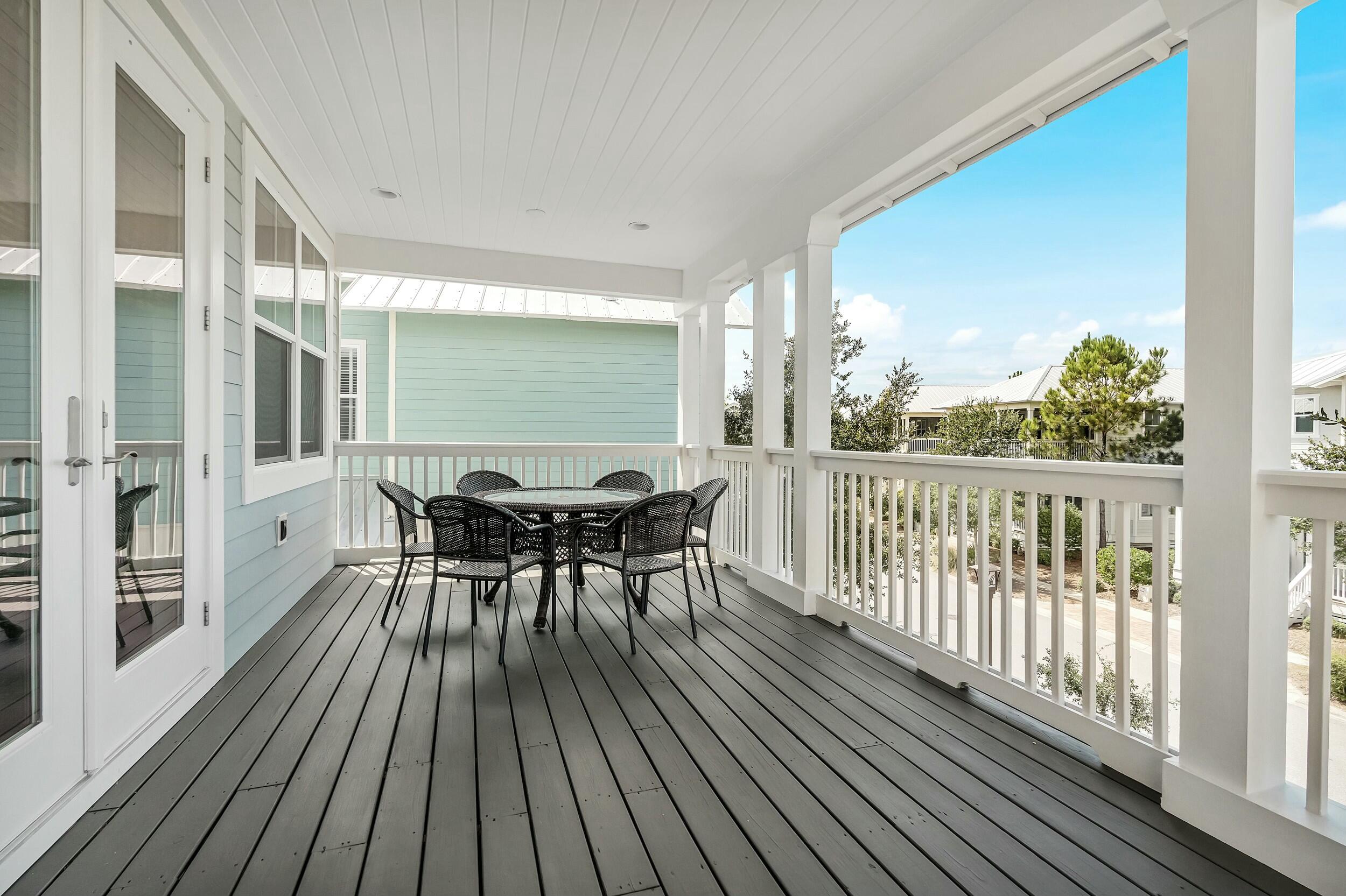 673 Flatwoods Forest Loop Santa Rosa Beach, FL 32459 - Photo 15 of 41 a view of a balcony with furniture