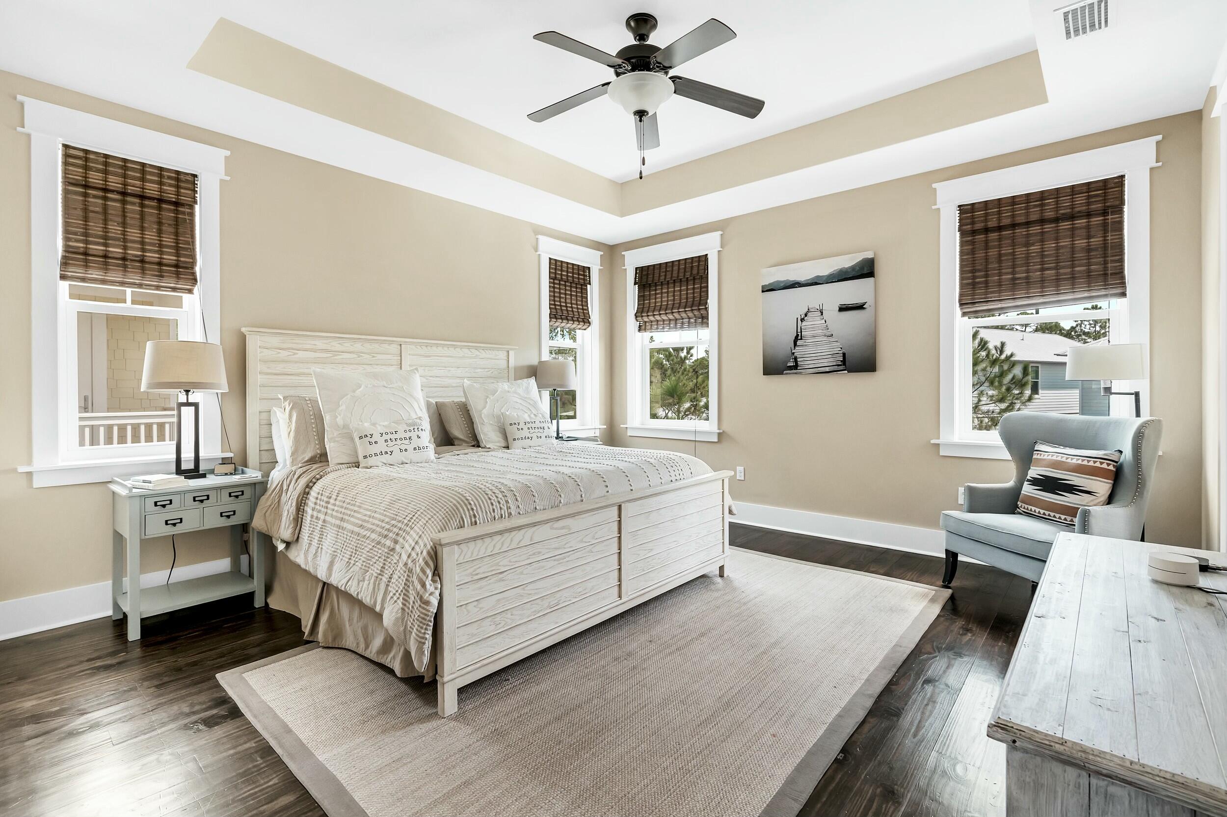 673 Flatwoods Forest Loop Santa Rosa Beach, FL 32459 - Photo 18 of 41 a bedroom with a large bed and windows