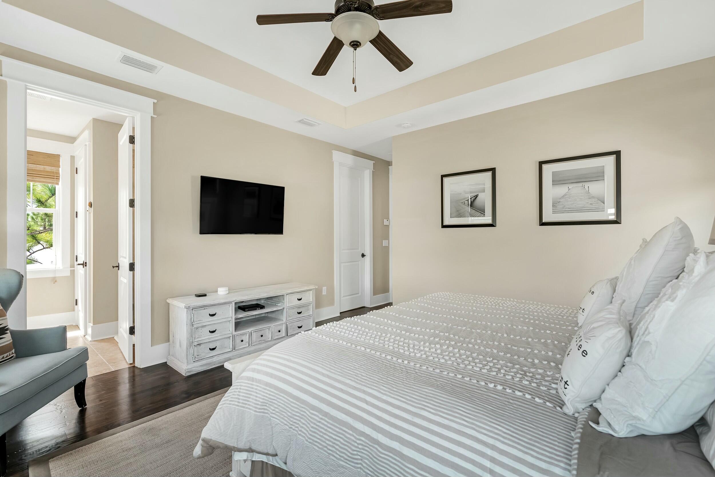 673 Flatwoods Forest Loop Santa Rosa Beach, FL 32459 - Photo 19 of 41 a bedroom with a bed and a flat screen tv