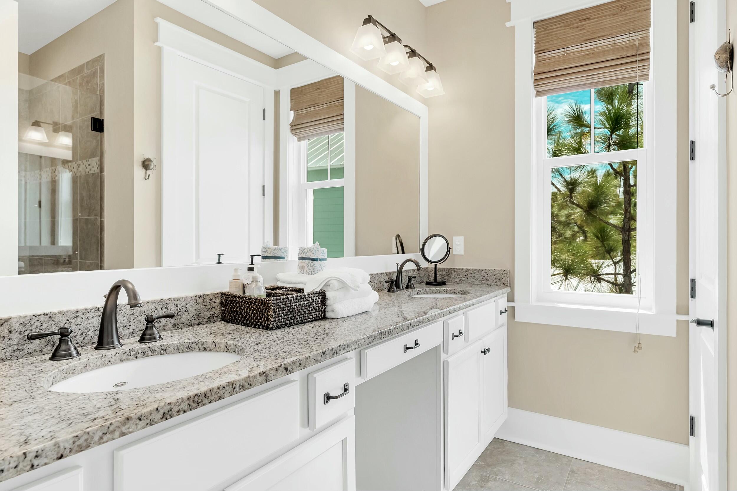 673 Flatwoods Forest Loop Santa Rosa Beach, FL 32459 - Photo 20 of 41 a bathroom with a granite countertop sink and a window