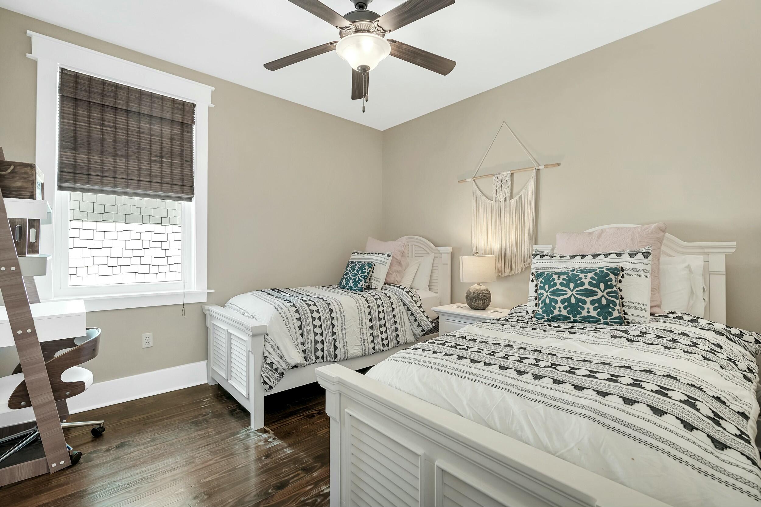 673 Flatwoods Forest Loop Santa Rosa Beach, FL 32459 - Photo 22 of 41 a bedroom with two beds and a window