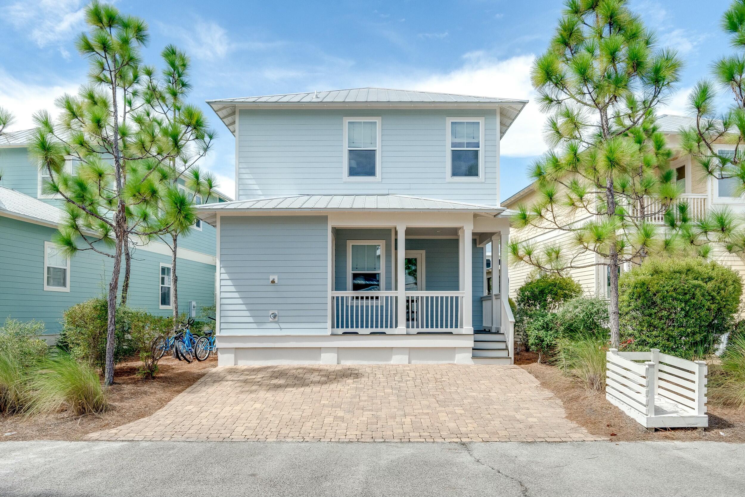 673 Flatwoods Forest Loop Santa Rosa Beach, FL 32459 - Photo 27 of 41 a house with a garden view