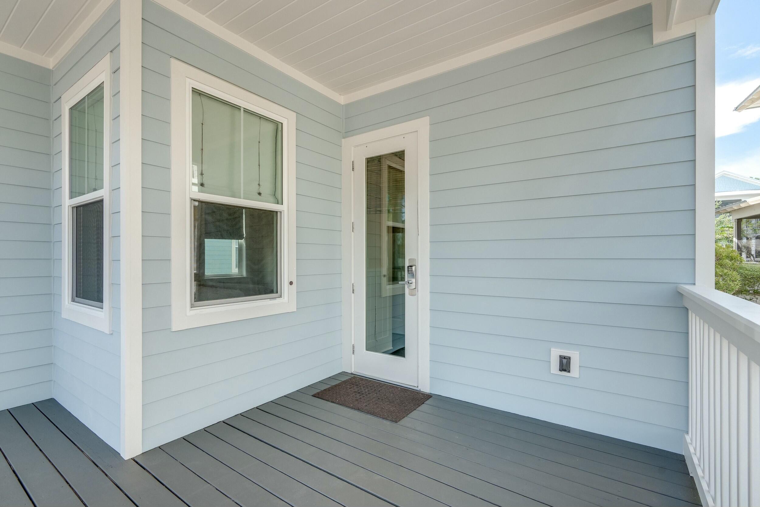 673 Flatwoods Forest Loop Santa Rosa Beach, FL 32459 - Photo 28 of 41 a view of an empty room with wooden floor and a window