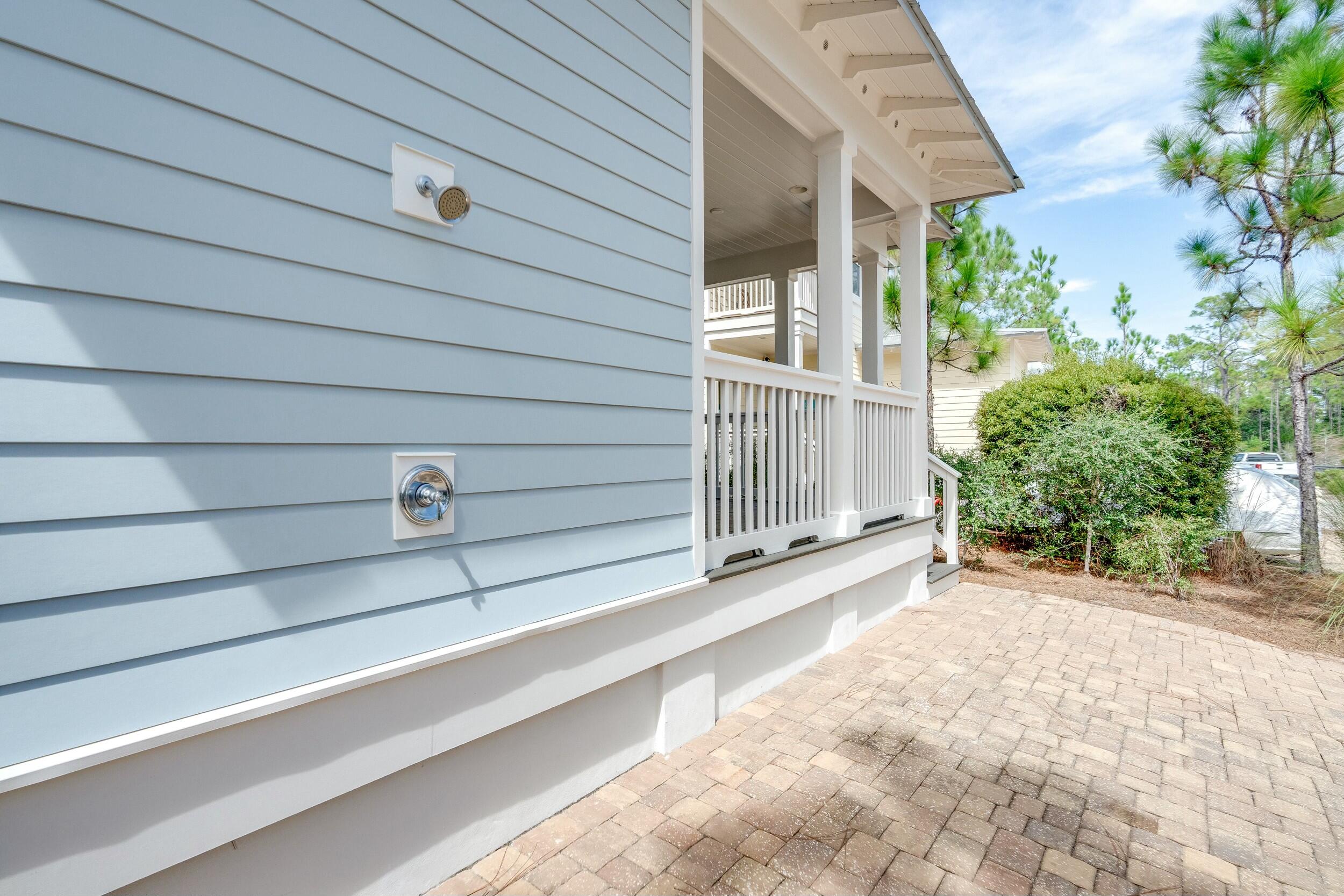 673 Flatwoods Forest Loop Santa Rosa Beach, FL 32459 - Photo 29 of 41 a view of a backyard with plants and a garage